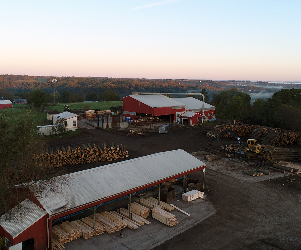 Aerial view of AJ Logging sawmill and log yard offering forestry management in Ohio